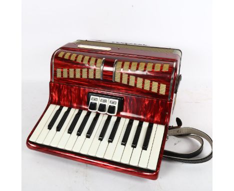 A Lyra piano accordion, cased, various tutorial ephemera and music posters of Roy Wood and Wizard 