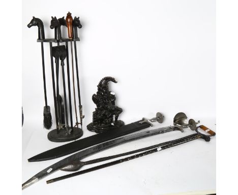 2 reproduction swords, an ebony and bone walking stick, a Mr Punch doorstop, and a companion set 