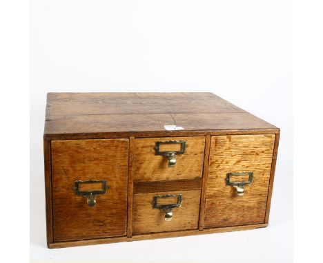 An early 20th century light oak index filing cabinet, W49cm, H24cm, D40cm 