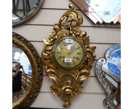 A reproduction gilt-gesso Cartel clock, with 8-day movement, by Exacta, Sweden, height 60cm 