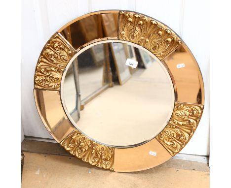 An Art Deco circular wall mirror, with peach glass and embossed gilt frame, height 60cm 