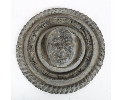 A Vintage lead clock face, with portrait decoration, 22cm 