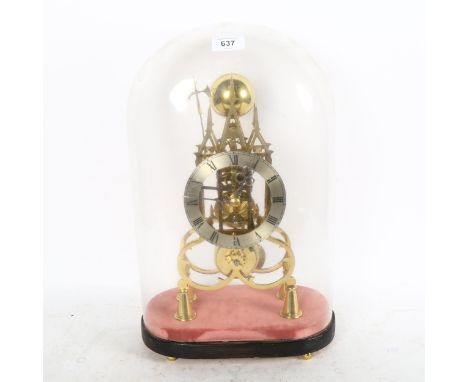 A reproduction brass skeleton clock, Gothic architectural design, with silvered chapter ring, striking on a bell under glass 