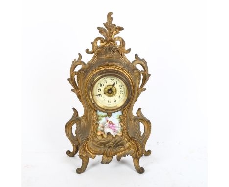 An Art Nouveau gilded spelter foliate mantel clock, with printed porcelain panel, height 28cm, working order 