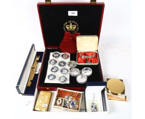 A collection of 50p Jubilee encapsulated coins, a silver and enamel charm bracelet, costume jewellery, Straton compact etc