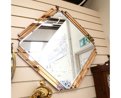 An Art Deco style peach and clear glass geometric mirror, etched design, width 72cmGood condition overall. A few minor surfac