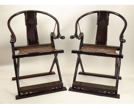 Pair of Antique Chinese Folding Ox Bow Back Black Chairs with Woven Twine Seats and Brass Mounts. Unsigned. Light Wear and Ru