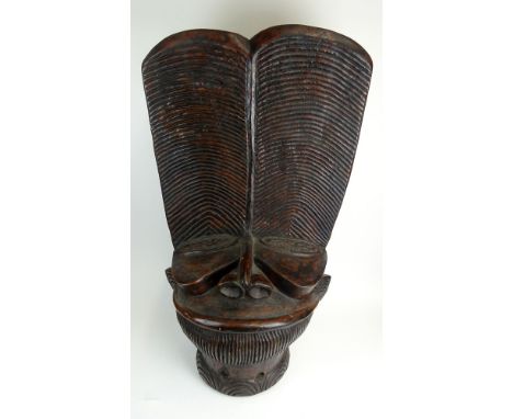 African Cameroon Wood Figural Ancestors Head Carving. Unsigned. Light Wear and Rubbing. Measures 39 Inches by 21 Inches by 13