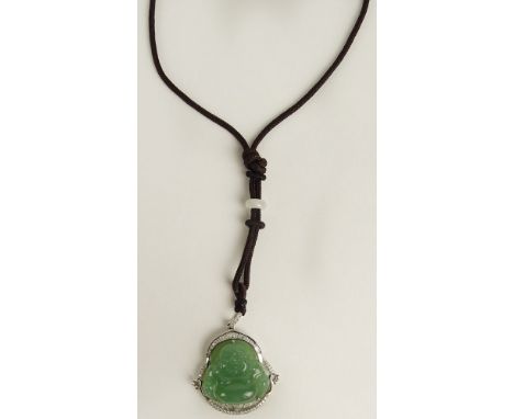 Vintage 14 Karat White Gold and Carved Celadon Jade Hotei Pendant accented with Small Round and Baguette Diamonds. Diamonds F