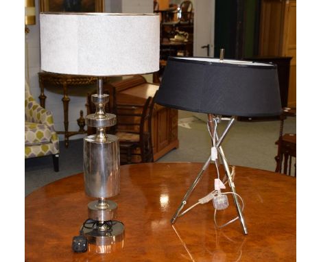 A modern silvered table lamp horse hide shade, 80cm together with another similar table lamp on three legs, 70cm