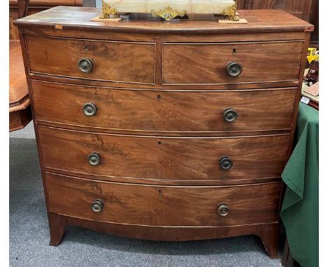 A Regency mahogany bow-front chest of drawers, 2nd quarter 19th century, two short over three long graduated drawers, on spla