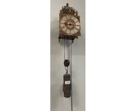 A lantern form hook and spike striking wall clock, unsigned, late 18th century, lantern form case with top pierced frets, sid