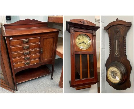 An early 20th century mahogany music cabinet with Art Nouveau copper handles, an oak barometer and a mahogany wall clock (3)