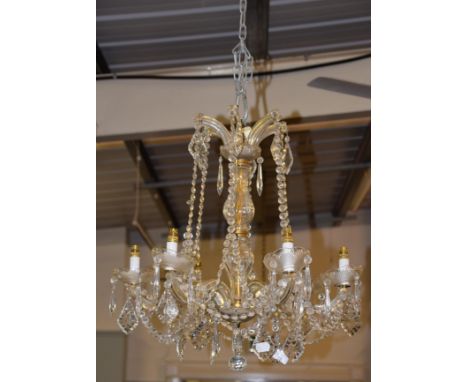 A Venetian style lustre drop six light chandelier
