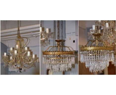 A twelve branch chandelier with lustre drops, 55cm drop, together with a pair of gilt metal ovoid two tier bag chandeliers 34