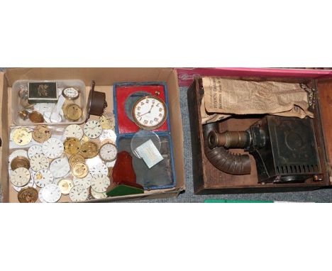 A box of assorted pocket watch movements, wrist watch movements etc and a boxed Gloria EP magic lantern with illustrated slid