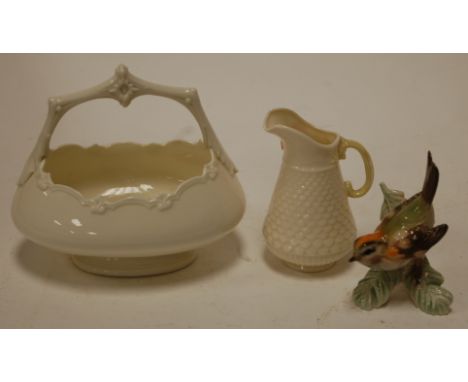 A small Worcester basket shape No. 1954 green mark verso together with a modern belleek jug and a Goebel figure of a bird (3)