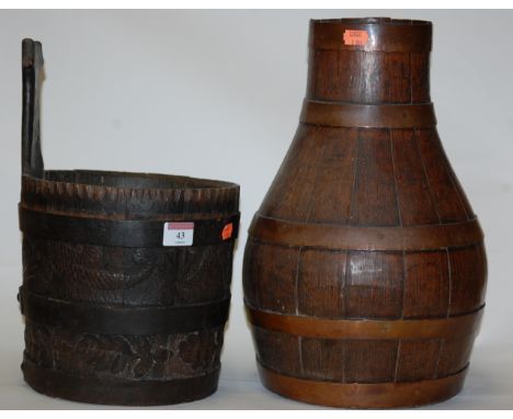 A carved and coopered oak planter; together with a similar jug (2)