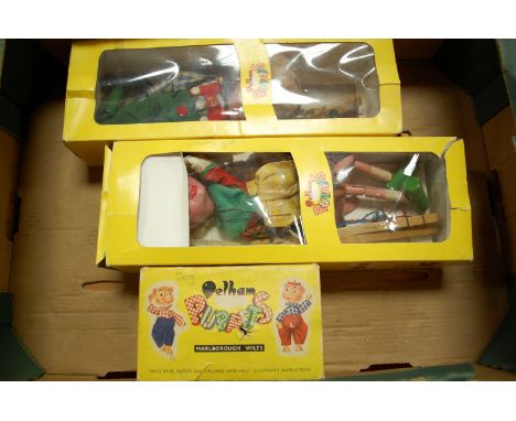 Two boxed Pelham Puppets - Young Girl and Clown; together with one other boxed dog puppet (3)