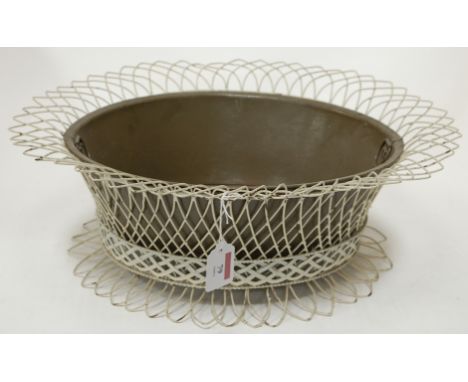 A wirework planter of oval form with liner