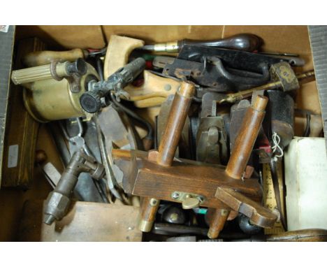 A box of assorted 19th century and later hand tools to include moulding planes, saw etc