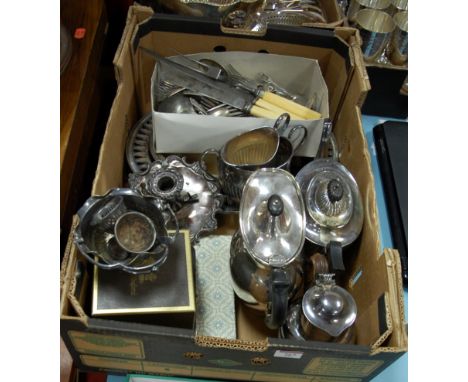 A box of miscellaneous silver plated wares to include; three piece tea service, chamberstick, loose flatware etc 