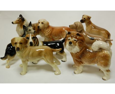 A collection of assorted ceramic dog figures to include Coopercraft examples