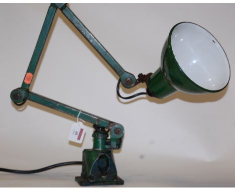 A green painted industrial anglepoise style lamp