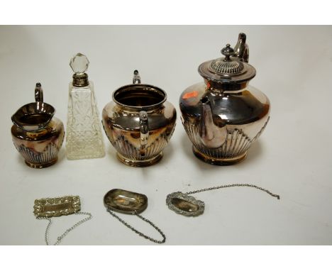 A circa 1900 cut glass and silver mounted scent bottle; together with a silver plated three piece tea service; decanter label