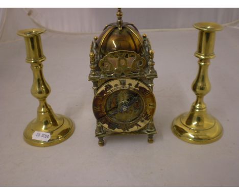 BRASS MANTLE CLOCK AND PAIR OF BRASS CANDLESTICKS