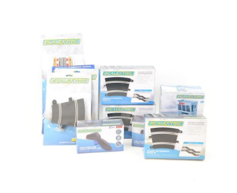 Modern Scalextric track and accessories, including three C8555 Track Extension Pack 6, C8319 Race+ Control Tower, two C8438 A