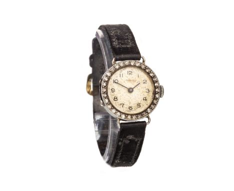 LADY'S GARRARD DIAMOND SET MANUAL WIND WRIST WATCH, the round dial with Arabic numerals in black, black pencil hands, 21.5mm 