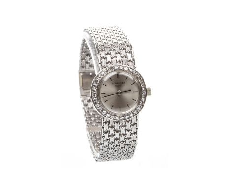 LADY'S LONGINES EIGHTEEN CARAT WHITE GOLD DIAMOND SET MANUAL WIND COCKTAIL WATCH, signed Longines 17 jewel movement, the roun