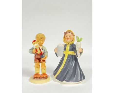 A Goebel Hummel figurine, 'Nutcracker Sweet', of a boy holding a nutcracker (marked verso- no. 2130), together with another G