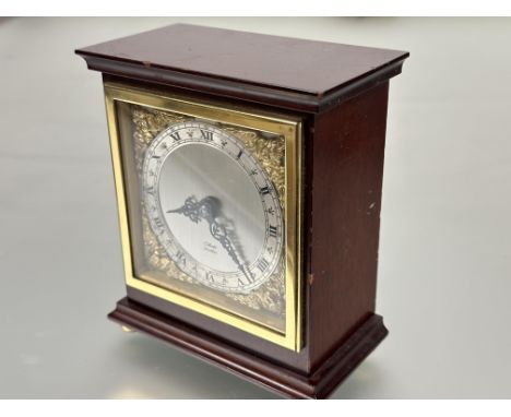 A Elliot of London mahogany cased mantle clock with silver dial, roman numerals and cast brass cherub spandrels&nbsp; with ma
