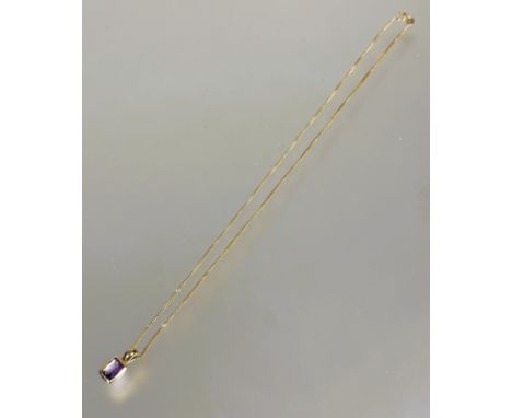 A 9ct gold mounted cushion cut amethyst in rub over setting mounted on 9ct flat link chain with ring clip fastening L x 14cm 