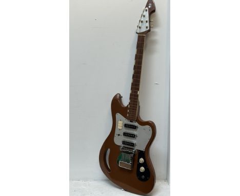 A Vintage Del Rey ET-320 acoustic electric guitar made in Japan with original silvered label verso finished in brown L x 106c