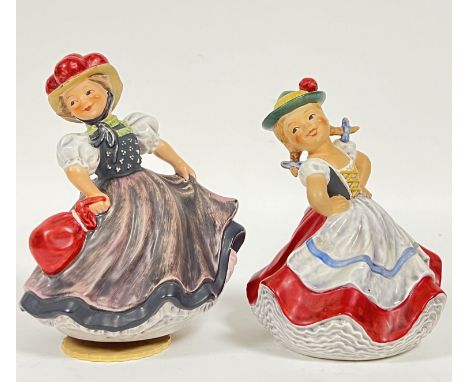 A Goebel musical dancing girl figurine (h- 18cm, w- 13cm1968, ff 301), together with a similar Goebel dancing girl figure (ff