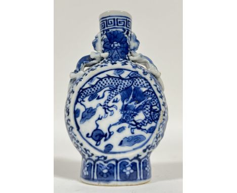 A Chinese miniature porcelain Kangxi-revival blue and white moon flask, decorated with dragons and flaming pearl in panels (h
