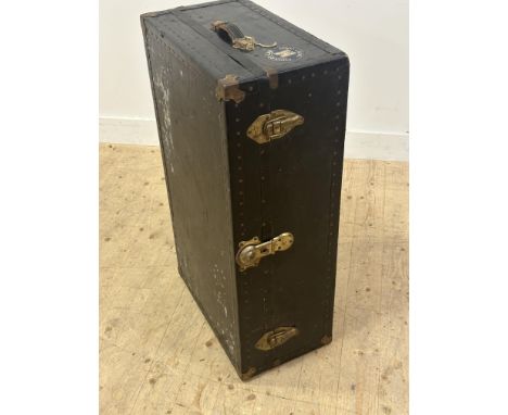 A vintage black coated and brass mounted cabin style trunk complete with Cunard Line White Star tourist class label with orig