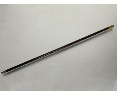 A military style brass topped strutting stick with metal shaft with enamel calamander style decoration stamped 2nd Low Boe T.