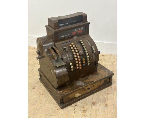 A Vintage decorative National shop till in with cast metal wood grained panels and pull opening till drawer but not operation