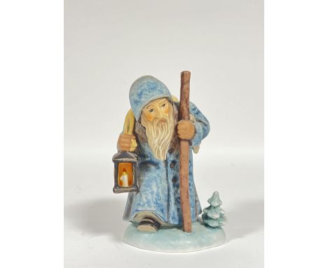A Goebel Hummel 'Ruprecht' figurine of a man carrying a sack and lantern (marked verso, h- 15cm)