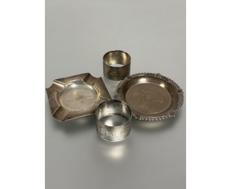 A Birmingham silver engine turned napkin ring with engraved initial F and another with initials MPS, a Birmingham silver asht