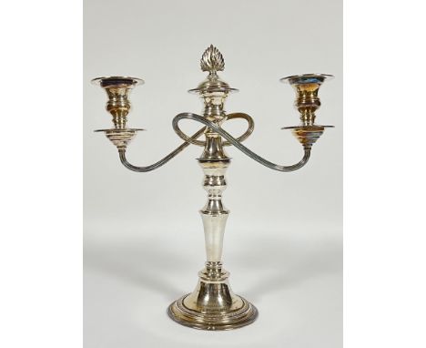 A silver plated candelabrum/candlestick holder with detachable top section, reducing to a single candlestick holder with mili