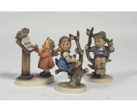 A collection of Hummel figures comprising, "Apple Tree Girl", "Apple Tree Boy" and "Bird Duet". (all marked verso) (3)&nbsp;