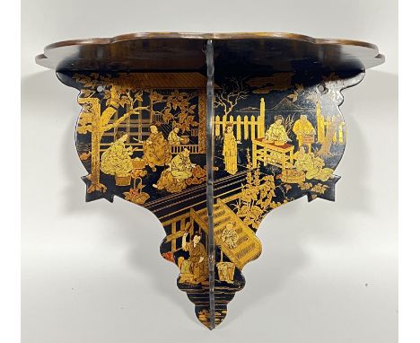 A chinoiserie lacquer folding wall bracket decorated with gilt figural scenes (h- 28cm, w- 34cm)