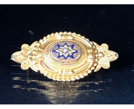 Victorian Gold coloured mourning brooch with central star design and a single seed pearl, the gold star mount accented with b
