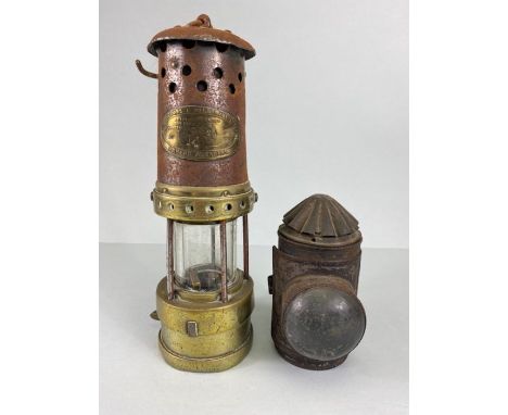 Miners Lamp, A Miners lamp by Thomas &amp; Williams Ltd, Aberdare, an antique hand held tin candle lamp and metal candle lamp