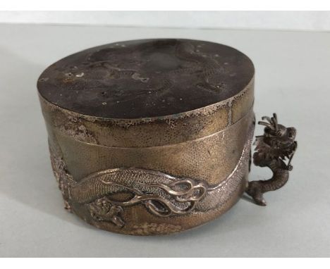 A Silver Chinese lidded pot with raised dragon decoration underside stamped 'WH' 90 with character mark raised on dragon feet